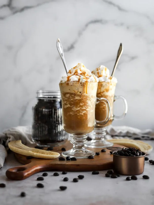 Creamy cordyceps coffee frappé topped with whipped cream and coconut.
